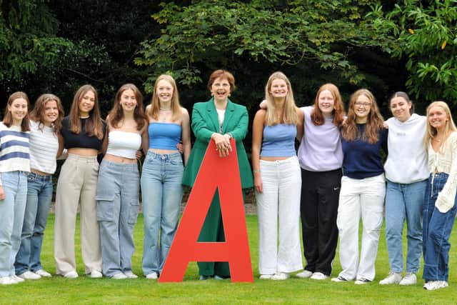 Mrs Sylvia Brett of Harrogate Ladies' College celebrating with pupils after receiving a fantastic set of A-level results