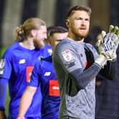 Mark Oxley applauds Harrogate Town's travelling fans following Tuesday night's goalless draw at Grimsby. Pictures: Matt Kirkham