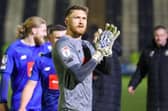 Mark Oxley applauds Harrogate Town's travelling fans following Tuesday night's goalless draw at Grimsby. Pictures: Matt Kirkham