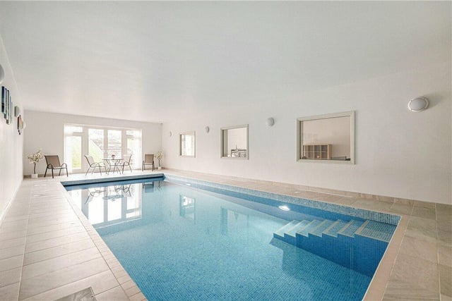The indoor heated swimming pool, with access to a private sunken patio area.