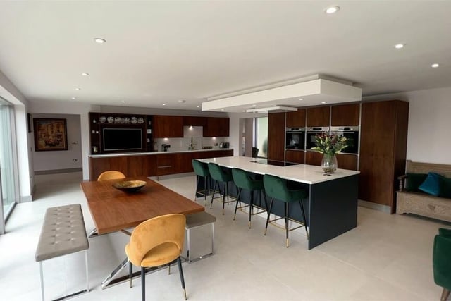 The sleek, high spec kitchen with diner has a full range of integrated appliances.