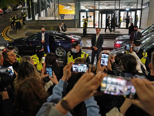 People watch the former US president Barack Obama leave the University of Strathclyde in Glasgow during the Cop26 summit.