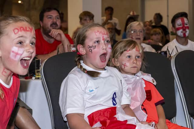 Members of the Killinghall Nomads Junior Football Club watching the Women's World Cup Final