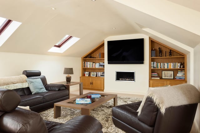 Flexible space on the upper floor with velux windows and fitted furniture.