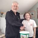 Helping Harrogate disabled charity - Western Primary School pupil Daniel Jackson  presenting the funds to Open Country Chief Officer David Shaftoe. (Picture contributed)