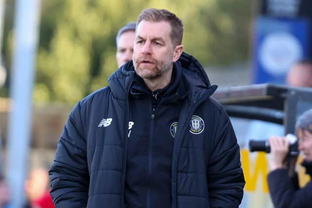 Sulphurites boss Simon Weaver watches on from his technical area.