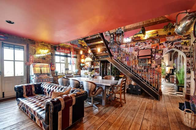 The Chapel's wrought iron staircase, 1950s jukebox and walls filled with memorabilia.