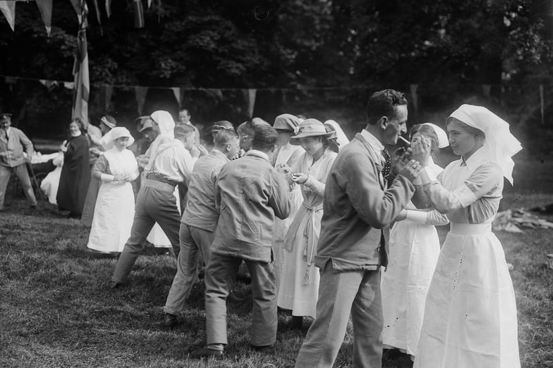 1916:  Princess Nima lights the cigarettes for wounded soldiers taking part in a cigarette race at a sports day in Harrogate.  (Photo by W. G. Phillips/Phillips/Getty Images)