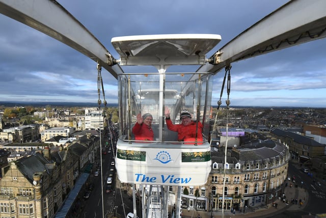 Visitors to the Harrogate Christmas Fayre enjoying a ride on the ferris wheel which offers spectacular views of the town