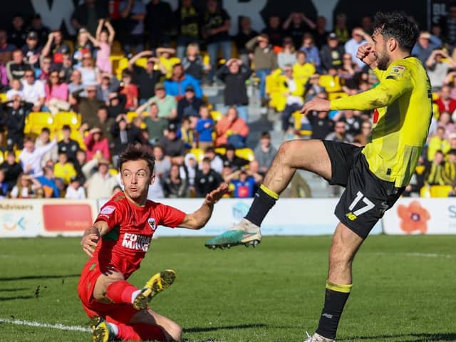 Levi Sutton fires home Harrogate Town's last-gasp equaliser during Good Friday's 2-2 draw with AFC Wimbledon. Pictures: Matt Kirkham