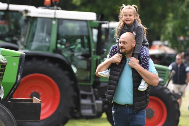Visitors of all ages enjoying the tractors on display at the festival