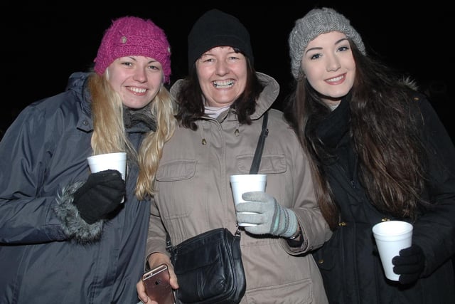 Elissa Young, Elaine Young and Stephanie Young keeping warm with a hot drink at the Harrogate Stray Bonfire in 2016