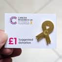 Wear a gold ribbon badge to show your support.