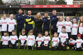 Harrogate Town and representatives from Aon mark International Women’s Day with #EmbraceEquity campaign pose