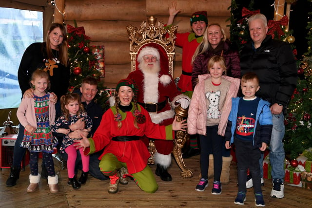 Father Christmas and his helper Tinsel the Elf entertain the children in Santa's Grotto at the Cedar Court Hotel