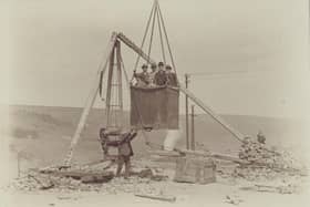 Angram Reservoir - VIP's having a ride in a large bucket lifted by a crane.