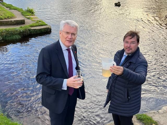 Harrogate and Knaresborough MP Andrew Jones and Frank Maguire, owner of the 550-home Knaresborough Lido, looking at a sample of the river water at the Nidd.