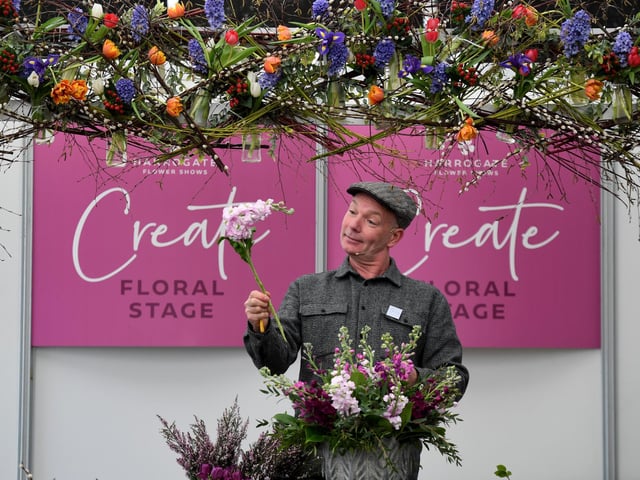 Jonathan Moseley during one of his floral arranging demonstrations on the Create! stage in the Floral Art pavilion