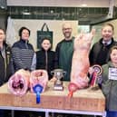 Pictured: Kendall's Farm Butchers with the young champion handlers and their prime homebred lambs.