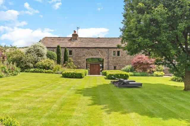 The stunning front aspect of Beck Bottom Barn, with loarge oak doors tot he hallway.