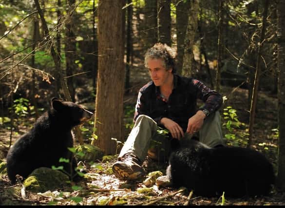 Exciting encounters - Scottish wildlife filmmaker Gordon Buchanan pictured in earlier times with bear cubs.