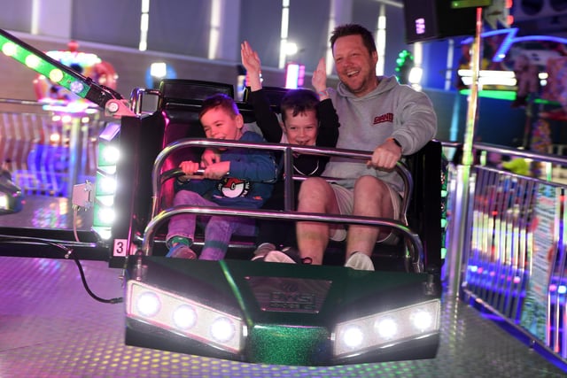 Pictured families enjoy the Sizzler ride.