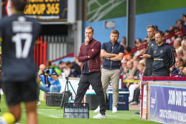 Sulphurites boss Simon Weaver watches on from his technical area at Glanford Park.
