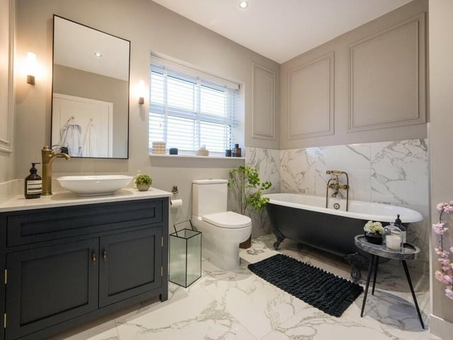 A super stylish bathroom with free standing bath.