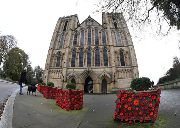 Poppies decorate planters outside Ripon Cathedral.