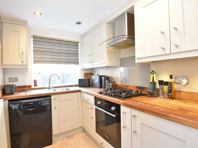 Part of the fitted kitchen with a gas hob and electric oven.