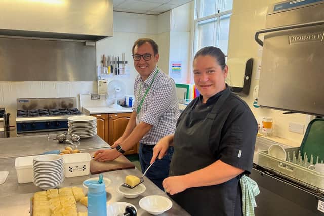 Harrogate and Knaresborough MP Tom Gordon with Harrogate Homeless Project chef Sue preparing food for a lunchtime service. (Picture contributed)