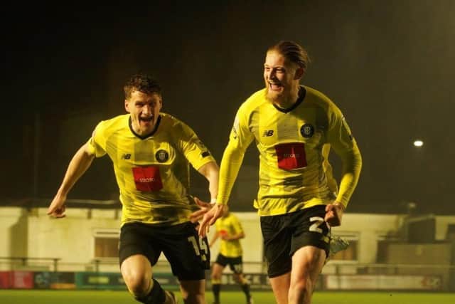 Luke Armstrong, right, celebrates after netting Harrogate Town's 50th-minute equaliser during Tuesday night's League Two clash with Northampton Town. Picture: Brody Pattison