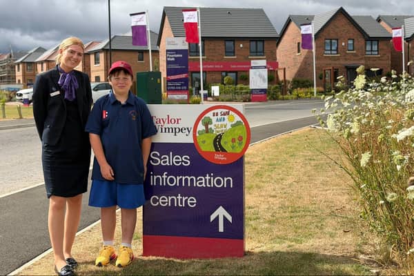 Arthur, 10, of Moorside Primary School, with his winning road safety sign at Taylor Wimpey's Fountains Walk development in Ripon