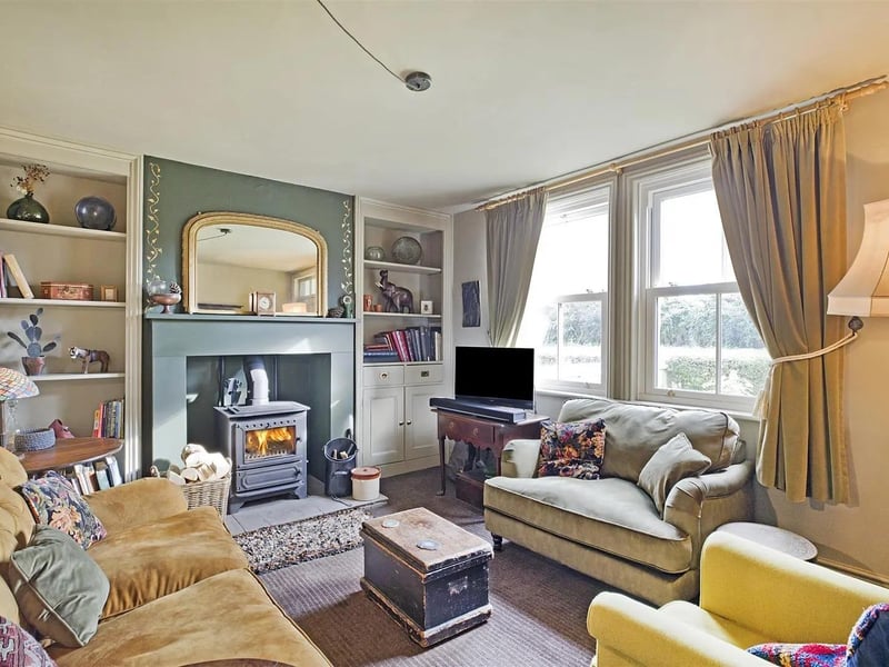 The comfortable lounge has a feature fireplace with wood-burning stove.