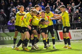 Harrogate Town's players celebrate Kayne Ramsay's stoppage-time winner during their 3-2 Boxing Day triumph over Grimsby Town. Pictures: Ben Roberts/ProSportsImages