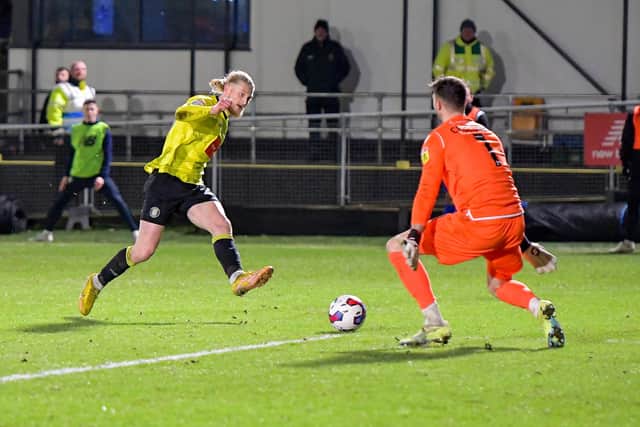 Luke Armstrong beats Grimsby Town goalkeeper Max Crocombe with a calm left-footed finish to draw Harrogate Town level in the 76th minute of Monday's League Two clash at the EnviroVent Stadium.