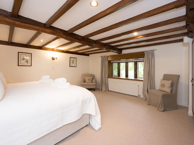 Another striking double bedroom within the country house.