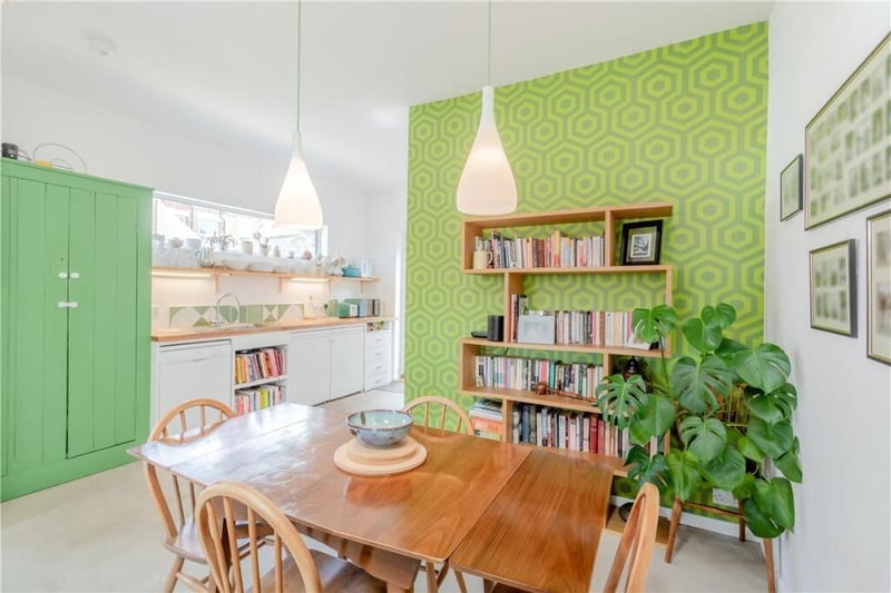 The dining area links to the modern kitchen.