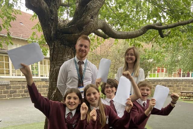 "The whole school was over the moon" - Alex Hope, headteacher of St John's C of E Primary School in Knaresborough with staff and pupils.  (Picture contributed)