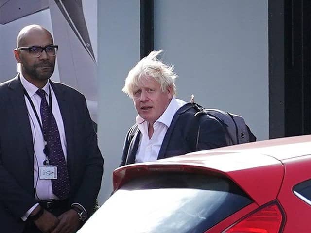 Former Prime Minister Boris Johnson arrives at Gatwick Airport in London, after travelling on a flight from the Caribbean, following the resignation of Liz Truss as Prime Minister. Picture date: Saturday October 22, 2022.