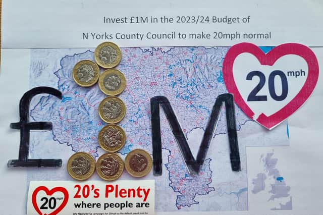 Campaigners' giant card calls for North Yorkshire County Council “to invest £1million in its 2023-24 budget to make 20mph normal”.