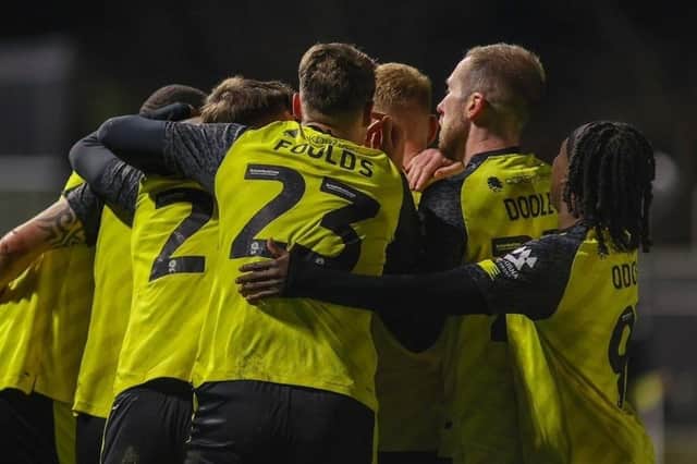 Harrogate Town celebrate after drawing level early in the second half of Tuesday evening's 2-2 home draw against Wrexham. Pictures: Matt Kirkham