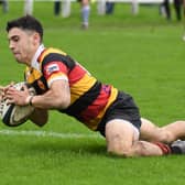 Jack Haydock dives over the try line during Harrogate RUFC's home win over Pontefract. Pictures: Gerard Binks