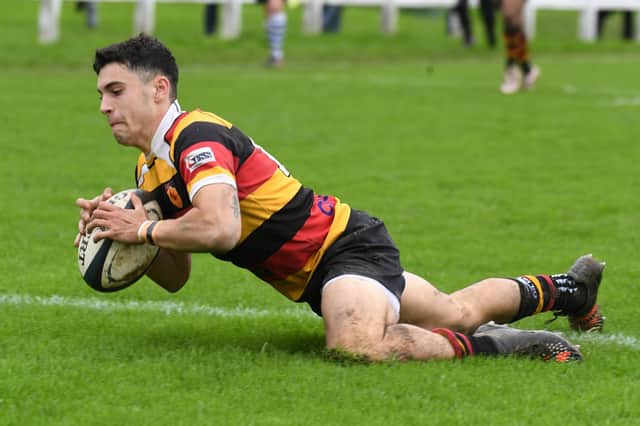 Jack Haydock dives over the try line during Harrogate RUFC's home win over Pontefract. Pictures: Gerard Binks