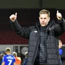 Harrogate Town manager Simon Weaver celebrates in front of the Sulphurites' travelling fans after his team secured their Football League status at Newport County. Picture: Graham Hunt/ProSportsImages