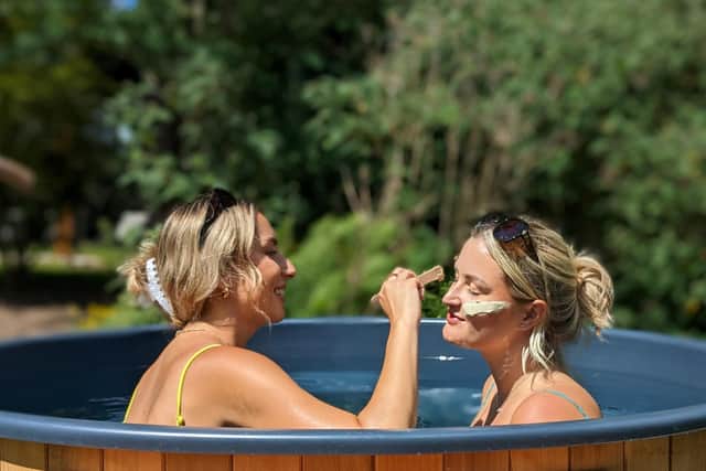 Back to nature - Guests applying a Moorish Mud Mask while enjoying outdoors bathing at Rudding Park's new woodland spa in Harrogate.