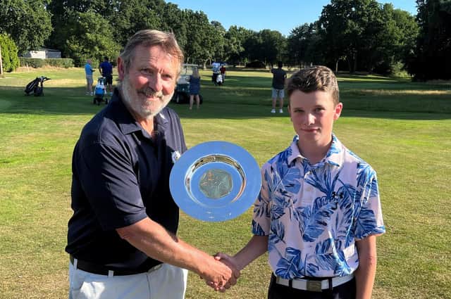 Oscar Knowles is presented with the Under-14 Boys Championship trophy by Yorkshire Union of Golf Clubs' president, Terry Collins. Picture: Submitted