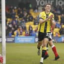 Tom Cursons celebrates after firing Harrogate Town into a 3-1 lead against Fleetwood, a result which guaranteed their Football League status for another season. Pictures: Paul Thompson/ProSportsImages