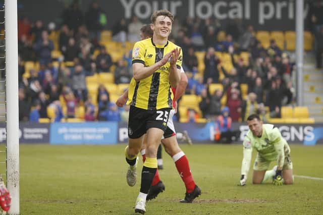 Tom Cursons celebrates after firing Harrogate Town into a 3-1 lead against Fleetwood, a result which guaranteed their Football League status for another season. Pictures: Paul Thompson/ProSportsImages