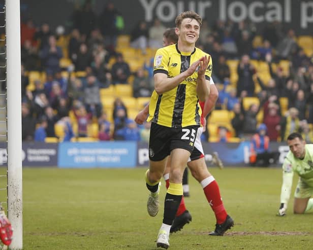 Tom Cursons celebrates after firing Harrogate Town into a 3-1 lead against Fleetwood, a result which guaranteed their Football League status for another season. Pictures: Paul Thompson/ProSportsImages